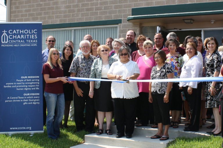 Allison (far right) at the opening of the current CCCTX Brazos Valley office in 2013.