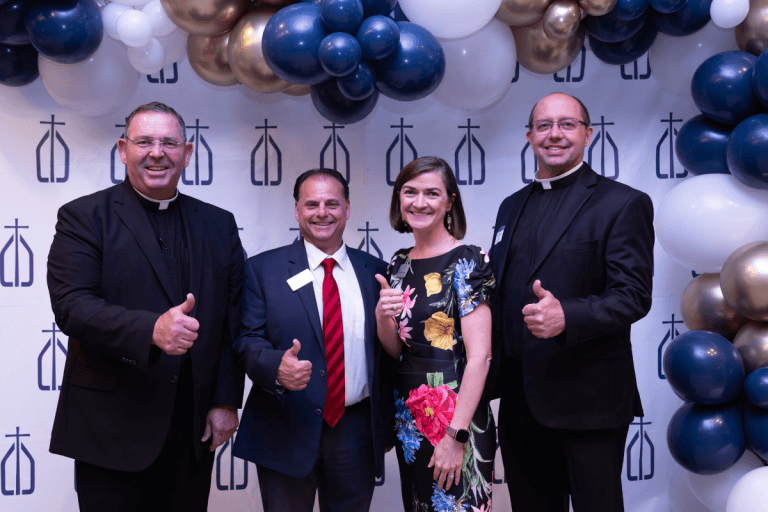 (From left) Very Rev. James Misko, John Paci (CCCTX Brazos Valley Director), Allison Cavazos, and Fr. Brian Eilers at a CCCTX event in the Brazos Valley.