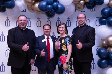 (From left) Very Rev. James Misko, John Paci (CCCTX Brazos Valley Director), Allison Cavazos, and Fr. Brian Eilers at a CCCTX event in the Brazos Valley.